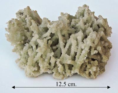 Prehnite, after laumonite. Bill Bagley Rocks and Minerals